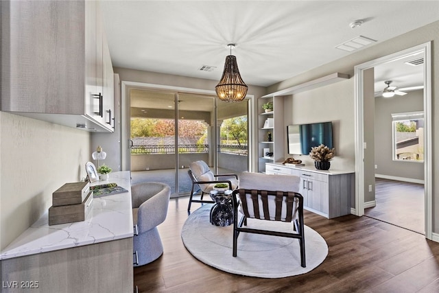 257 Elder View Dr, Las Vegas, NV 89138 - dining room with dark wood-type flooring, healthy amount of natural light, and a chandelier