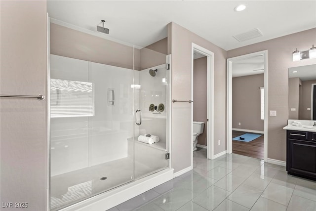 257 Elder View Dr, Las Vegas, NV 89138 - bathroom with a stall shower, baseboards, vanity, and toilet