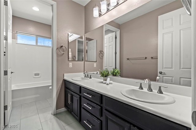 257 Elder View Dr, Las Vegas, NV 89138 - bathroom featuring double vanity, baseboards, and toilet