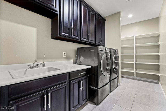 257 Elder View Dr, Las Vegas, NV 89138 - laundry area featuring washer and dryer, cabinet space, and light tile patterned flooring