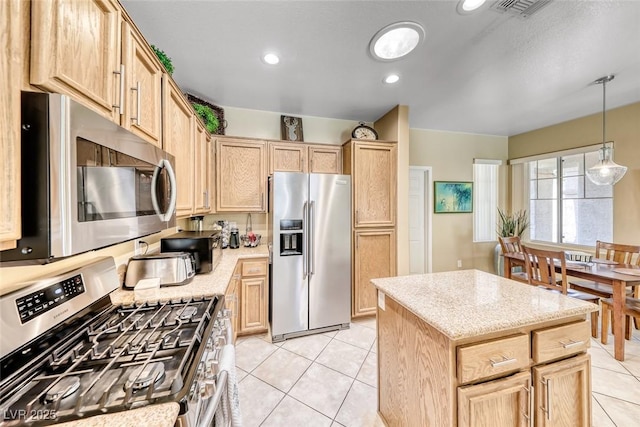 1862 Redwood Valley St, Henderson, NV 89052 - kitchen with visible vents, decorative light fixtures, appliances with stainless steel finishes, light tile patterned floors, and light brown cabinets