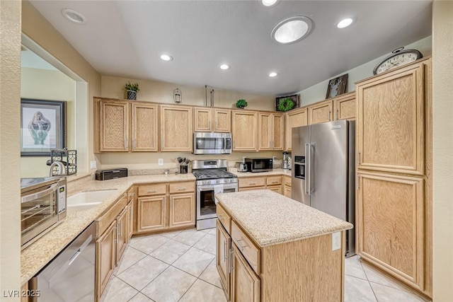 1862 Redwood Valley St, Henderson, NV 89052 - kitchen featuring appliances with stainless steel finishes, light tile patterned floors, and light brown cabinets