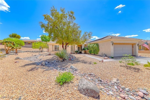 1862 Redwood Valley St, Henderson, NV 89052 - ranch-style house with a garage, stucco siding, concrete driveway, and roof mounted solar panels