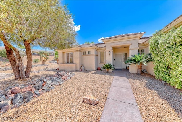 1862 Redwood Valley St, Henderson, NV 89052 - view of front facade featuring fence, stucco siding, solar panels, and a tiled roof