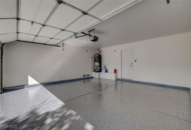 2212 Warm Walnut Dr, Las Vegas, NV 89134 - garage featuring strapped water heater and a garage door opener