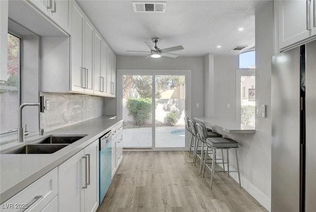 2212 Warm Walnut Dr, Las Vegas, NV 89134 - kitchen featuring a sink, appliances with stainless steel finishes, white cabinetry, light countertops, and recessed lighting