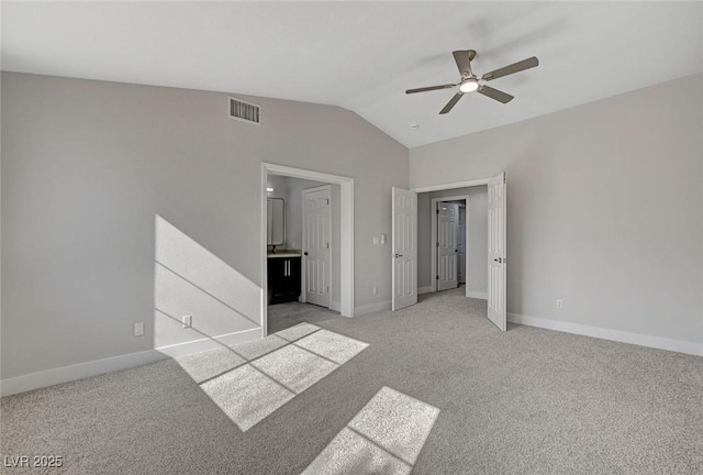2212 Warm Walnut Dr, Las Vegas, NV 89134 - unfurnished bedroom featuring lofted ceiling, baseboards, light colored carpet, and ceiling fan