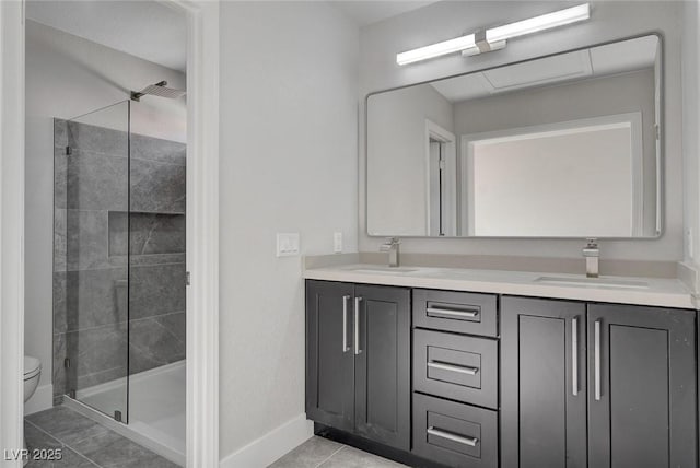2212 Warm Walnut Dr, Las Vegas, NV 89134 - full bathroom with a shower stall, toilet, baseboards, double vanity, and tile patterned flooring