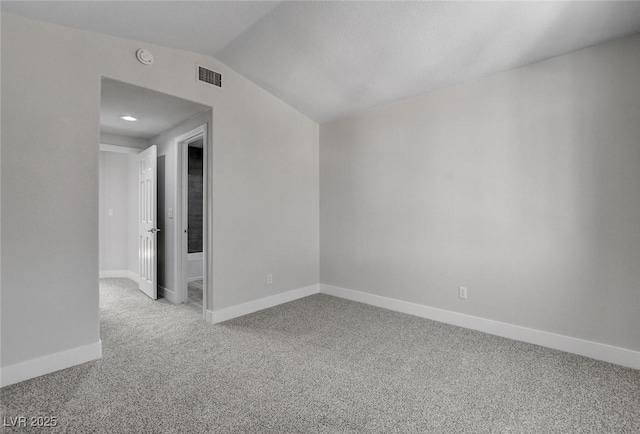 2212 Warm Walnut Dr, Las Vegas, NV 89134 - spare room featuring carpet floors, baseboards, lofted ceiling, and a smoke detector