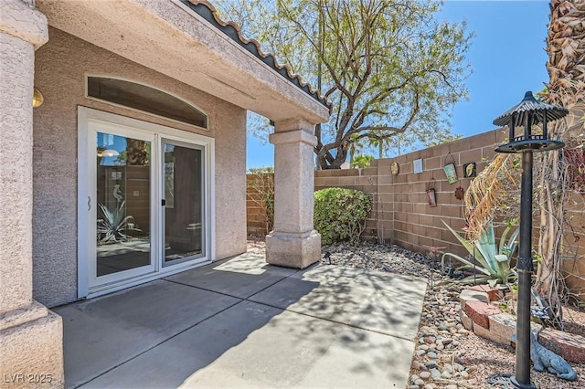 view of patio featuring fence