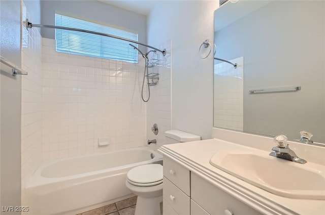 bathroom featuring vanity, tile patterned floors, bathtub / shower combination, and toilet