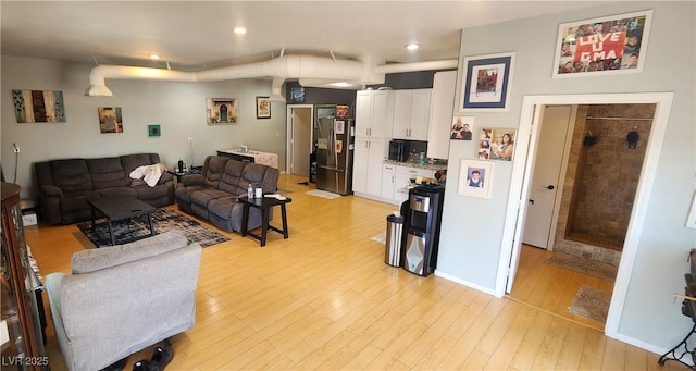 5312 Manuel Dr, Las Vegas, NV 89149 - living room featuring light wood-type flooring and recessed lighting