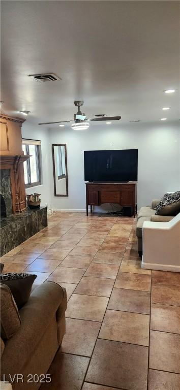 5312 Manuel Dr, Las Vegas, NV 89149 - living area with light tile patterned floors, a high end fireplace, and visible vents