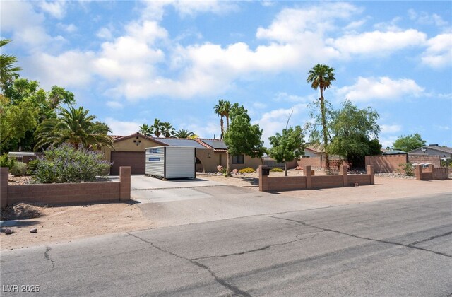 5312 Manuel Dr, Las Vegas, NV 89149 - view of front of home with a fenced front yard and driveway