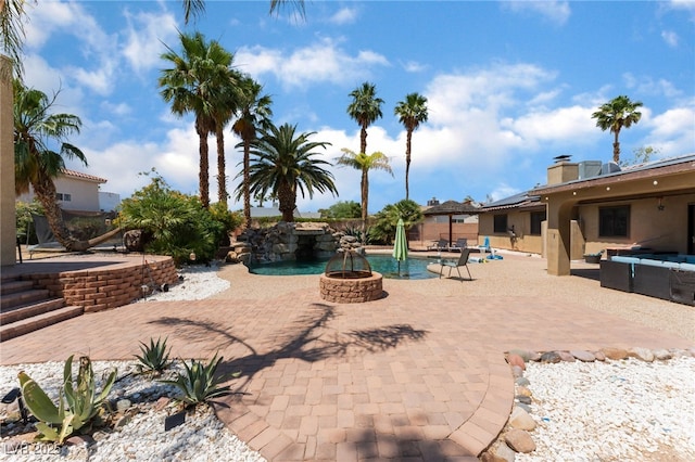 5312 Manuel Dr, Las Vegas, NV 89149 - view of swimming pool with a fire pit and a patio area