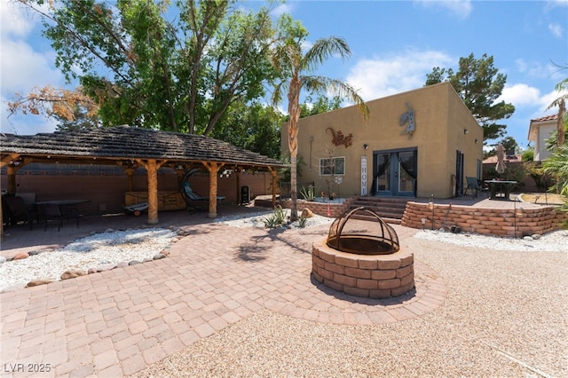 5312 Manuel Dr, Las Vegas, NV 89149 - view of patio featuring a fire pit and french doors