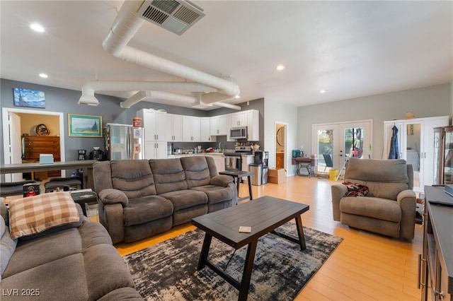 5312 Manuel Dr, Las Vegas, NV 89149 - living area with light wood-style flooring and recessed lighting