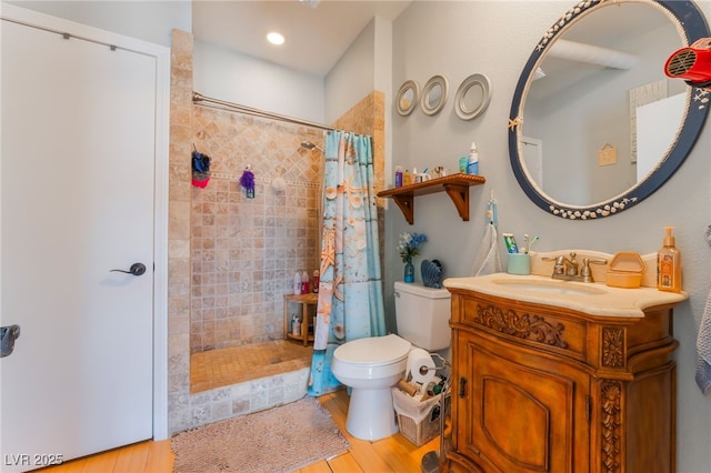 5312 Manuel Dr, Las Vegas, NV 89149 - full bathroom with toilet, a tile shower, vanity, and wood finished floors