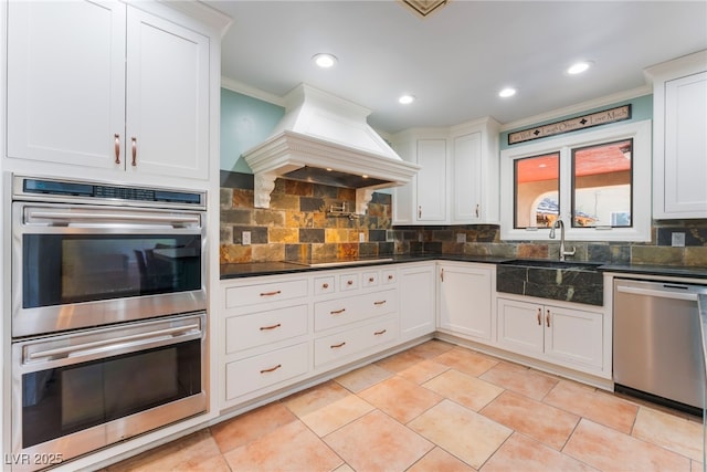 5312 Manuel Dr, Las Vegas, NV 89149 - kitchen with stainless steel appliances, a sink, dark countertops, ornamental molding, and decorative backsplash