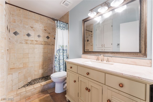 5312 Manuel Dr, Las Vegas, NV 89149 - full bath with toilet, vanity, a tile shower, and tile patterned flooring