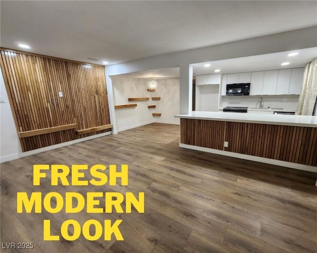4981 River Glen Dr Unit 63, Las Vegas, NV 89103 - interior space with recessed lighting, dark wood-style flooring, baseboards, and a sink