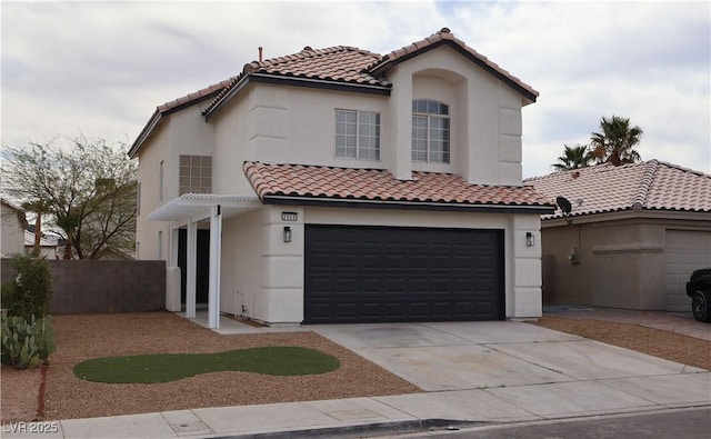 3686 Lincoln Rd, Las Vegas, NV 89115 - mediterranean / spanish home with stucco siding, an attached garage, a tiled roof, and concrete driveway