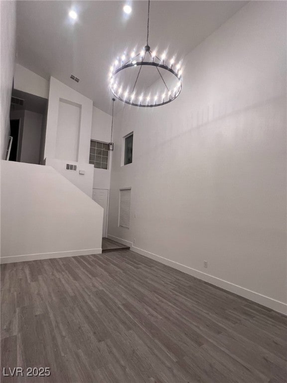 3686 Lincoln Rd, Las Vegas, NV 89115 - interior space featuring a notable chandelier, dark wood-style floors, baseboards, and visible vents