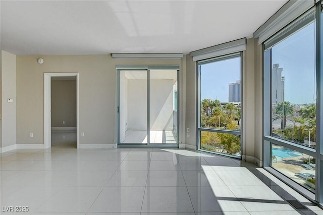 222 Karen Ave Unit 302, Las Vegas, NV 89109 - spare room featuring tile patterned flooring and baseboards