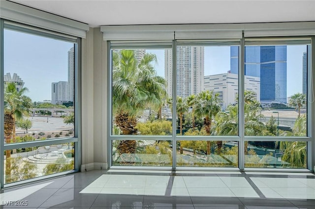 222 Karen Ave Unit 302, Las Vegas, NV 89109 - doorway with a view of city and tile patterned flooring