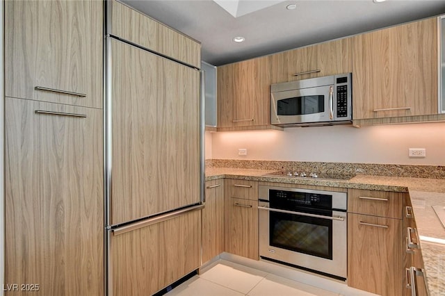 222 Karen Ave Unit 302, Las Vegas, NV 89109 - kitchen with recessed lighting, modern cabinets, appliances with stainless steel finishes, and light brown cabinets