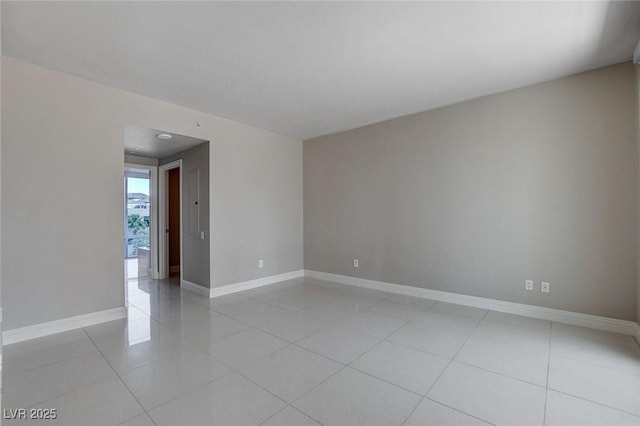222 Karen Ave Unit 302, Las Vegas, NV 89109 - unfurnished room featuring light tile patterned floors and baseboards
