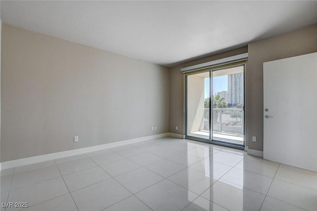 222 Karen Ave Unit 302, Las Vegas, NV 89109 - spare room with light tile patterned floors and baseboards