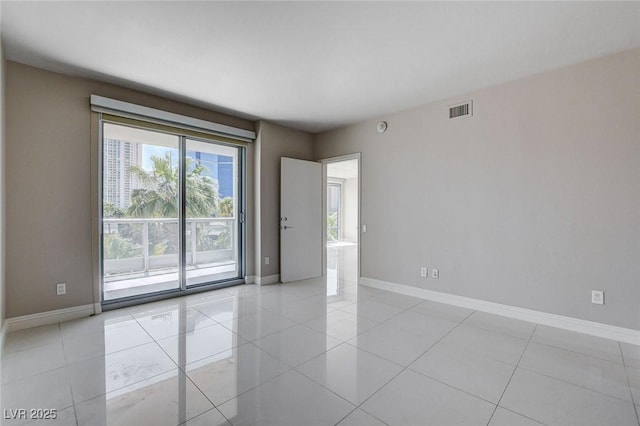 222 Karen Ave Unit 302, Las Vegas, NV 89109 - unfurnished room with light tile patterned floors, visible vents, and baseboards