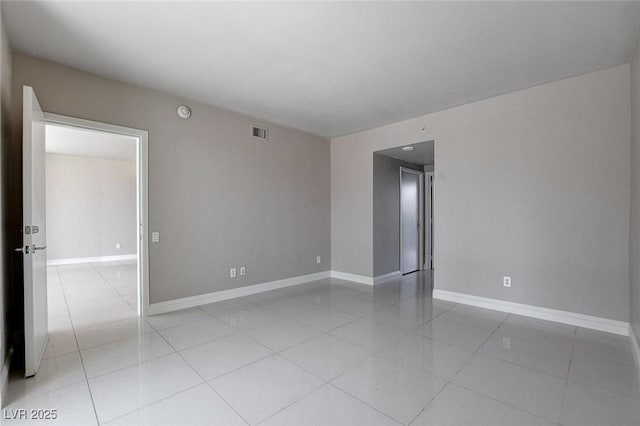 222 Karen Ave Unit 302, Las Vegas, NV 89109 - empty room featuring light tile patterned floors, visible vents, and baseboards