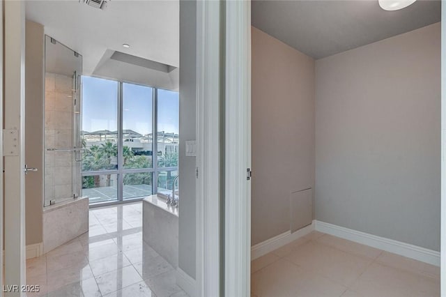 222 Karen Ave Unit 302, Las Vegas, NV 89109 - bathroom with a wall of windows and baseboards