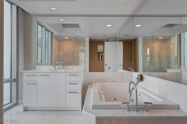 222 Karen Ave Unit 302, Las Vegas, NV 89109 - full bathroom with recessed lighting, a shower stall, vanity, a whirlpool tub, and tile patterned flooring