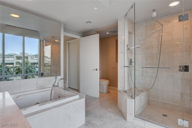 222 Karen Ave Unit 302, Las Vegas, NV 89109 - bathroom with a shower stall, visible vents, toilet, recessed lighting, and a garden tub