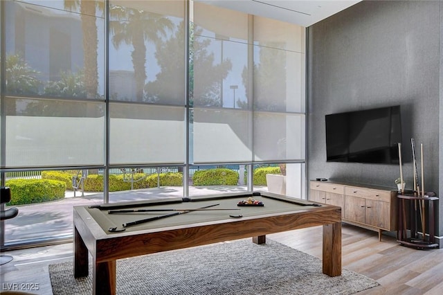 222 Karen Ave Unit 302, Las Vegas, NV 89109 - playroom featuring billiards, light wood-style floors, and plenty of natural light