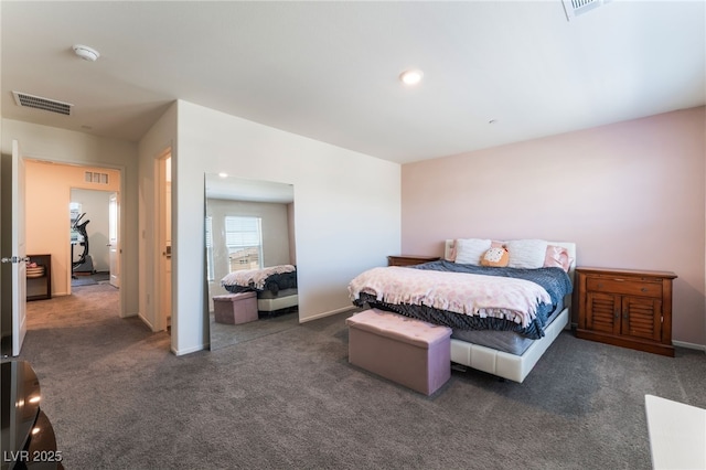 carpeted bedroom featuring baseboards and visible vents