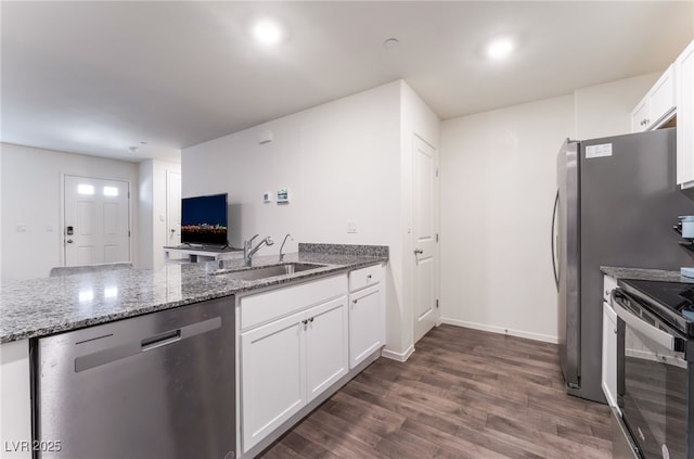 kitchen featuring dishwasher, a sink, dark wood-style flooring, black electric range oven, and light stone counters