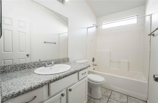 bathroom featuring tile patterned floors, toilet, shower / bathing tub combination, and vanity