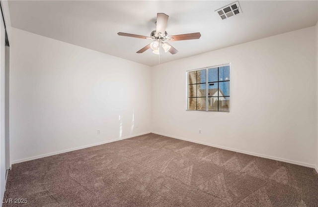 empty room featuring ceiling fan, baseboards, carpet, and visible vents
