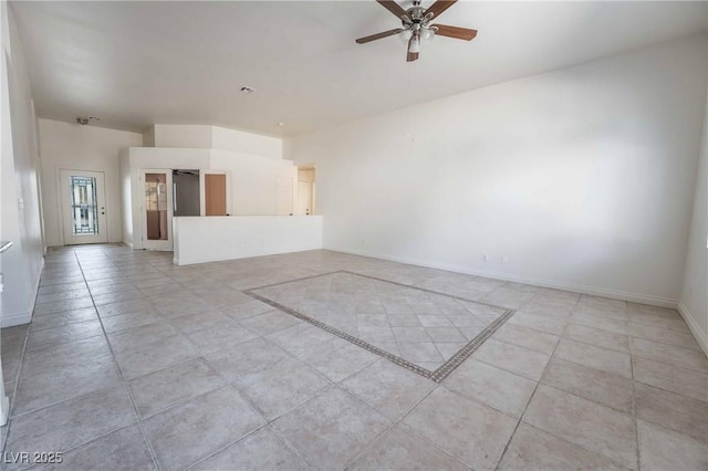 unfurnished living room with ceiling fan, baseboards, and light tile patterned flooring
