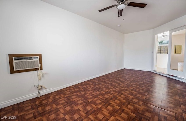 unfurnished room featuring a wall mounted AC, baseboards, and a ceiling fan