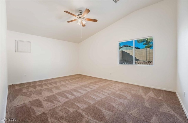 carpeted spare room with baseboards, a ceiling fan, and lofted ceiling
