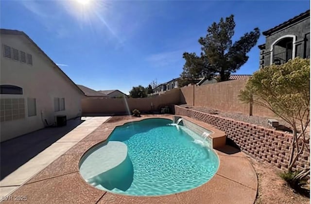 view of swimming pool featuring a patio area, a fenced backyard, and a fenced in pool