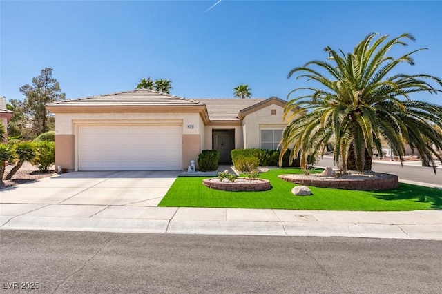 view of front of home with driveway, stucco siding, an attached garage, and a front lawn
