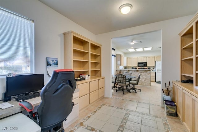 office space with a ceiling fan