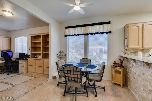 dining area with baseboards, a ceiling fan, and light tile patterned flooring
