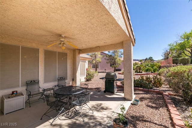 view of patio / terrace with outdoor dining space, fence, area for grilling, and ceiling fan